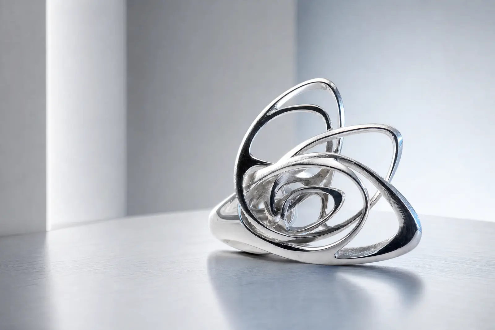 Polished metal knot sculpture